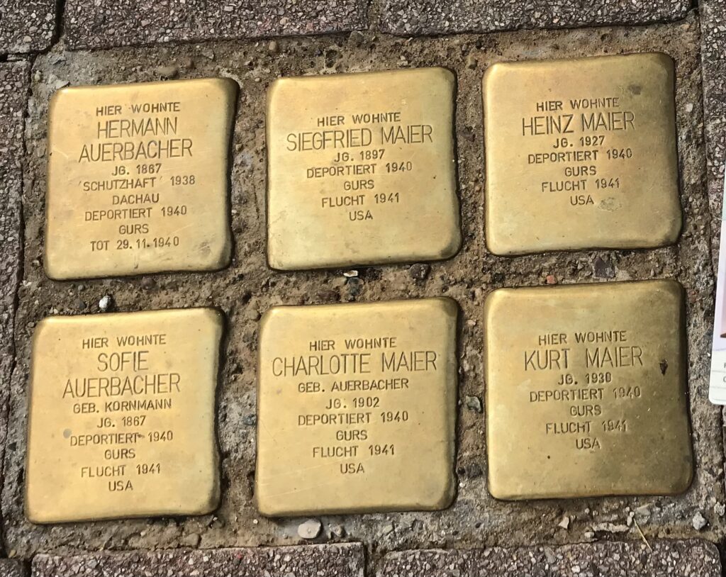 Memorial cobblestones honoring Holocaust victims in Germany.